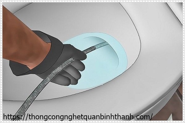 D&ugrave;ng d&acirc;y l&ograve; xo để th&ocirc;ng tắc bồn cầu